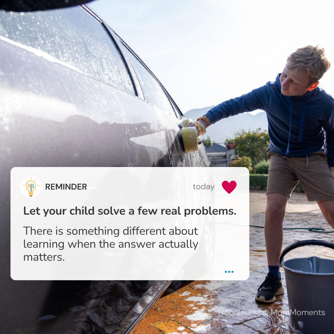 A boy washes a dark car outdoors with a sponge, with a prominent text overlay that reads 'REMINDER: Let your child solve a few real problems. There is something different about learning when the answer actually matters.