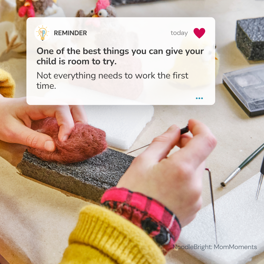 A close-up lifestyle scene shows a child's hands crafting with a brown wool-like material on a textured gray block, with a digital reminder card overlay reading 'One of the best things you can give your child is room to try.' The background is a warm beige tabletop with crafting tools and materials.