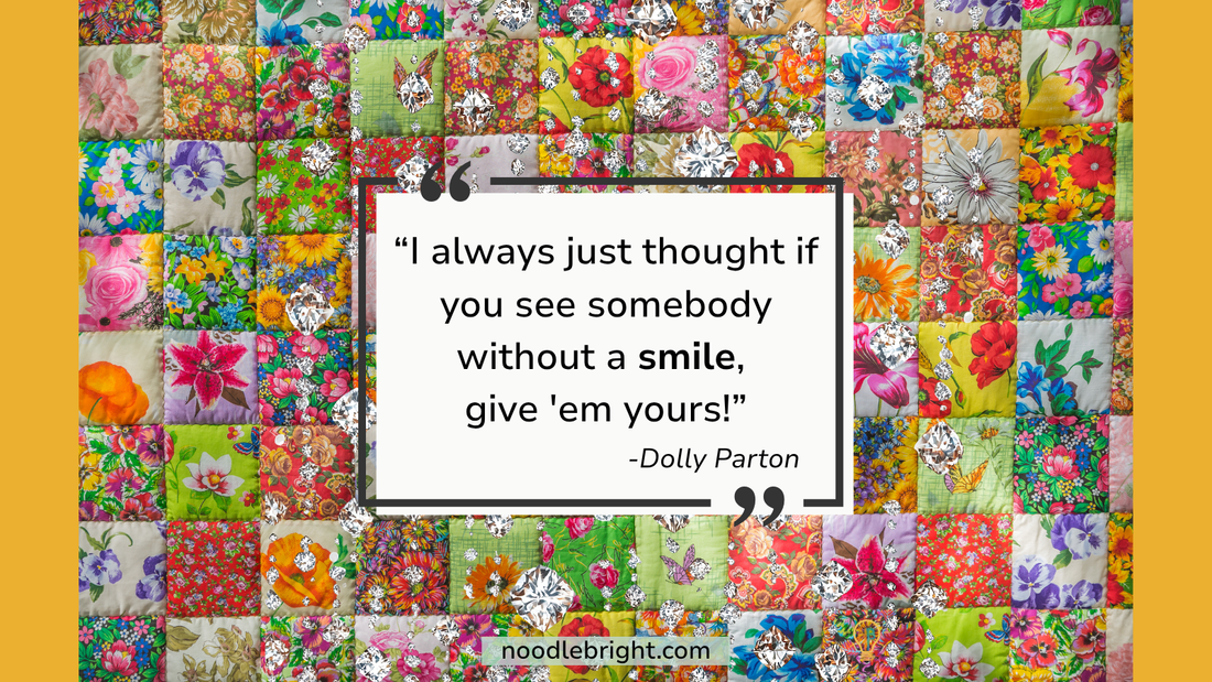Dolly Parton Quote: "I always just thought if you see somebody without a smile, give 'em yours!" Against a cheerful, floral quilted backdrop