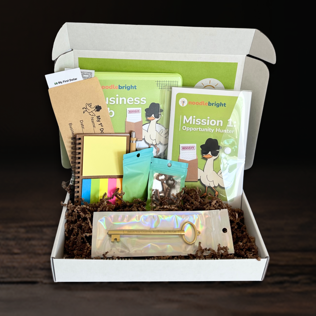Educational subscription box business lab items in a box with a dark background