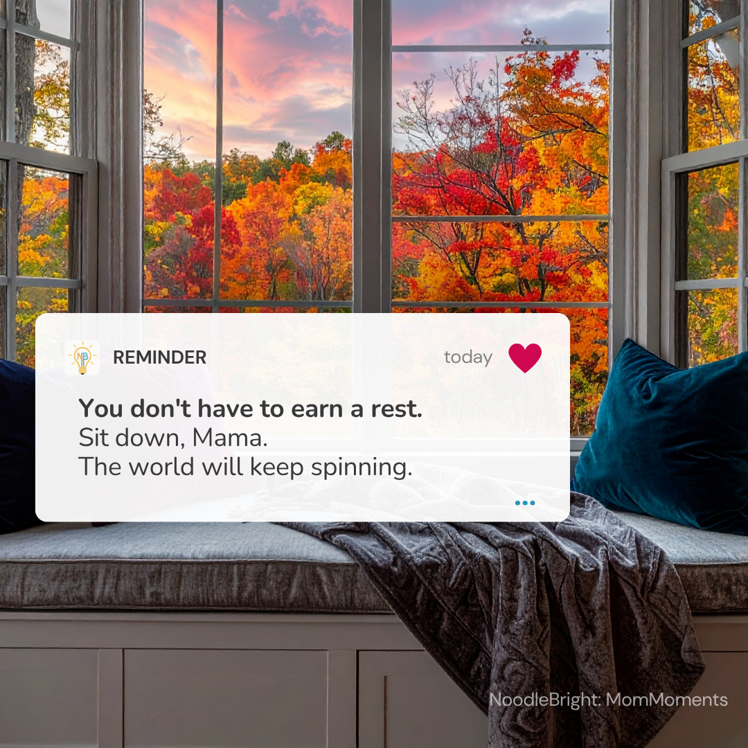 A digital reminder card for 'Mama' is displayed over a cozy window seat with autumn foliage outside. The card reads: 'REMINDER You don't have to earn a rest.