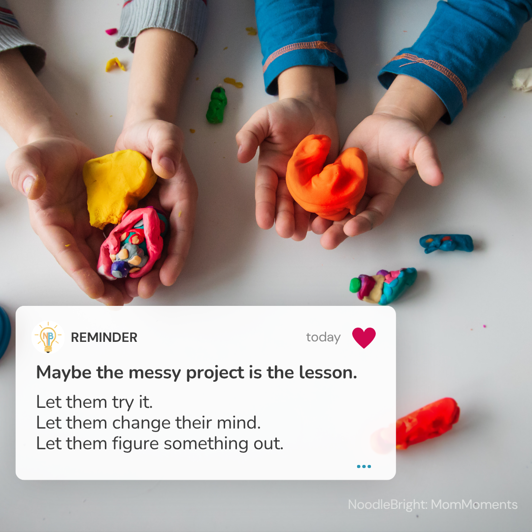 Four children's hands holding colorful play-dough creations on a white surface, with a reminder card overlaid at the bottom containing a quote about messy projects and letting children change their mind.